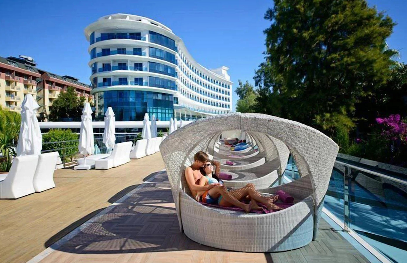 Artie Garden hotel project for Q premium Resort in Turkey, providing the handcrafted outdoor daybed, sun loungers, dining chairs, dining tables and outdoor sofa.